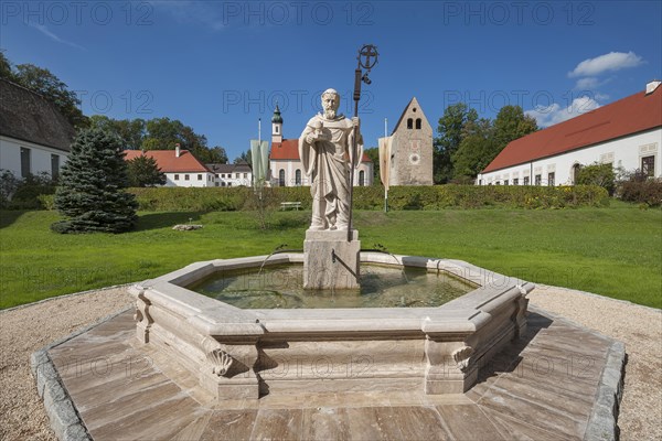 Monastery church with Roman tower and fountain with fountain figure of abbot Walto or Balto