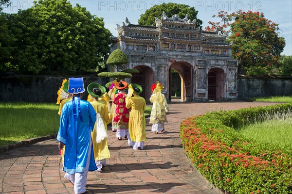 Vietnamese extras in traditional costumes going through West Gate