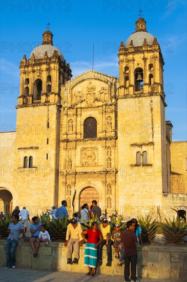 Native people in front of the church of Santo Domingo de Guzman