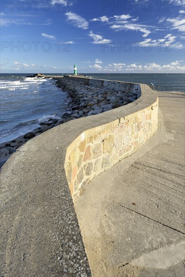 Mole with lighthouse in the harbour