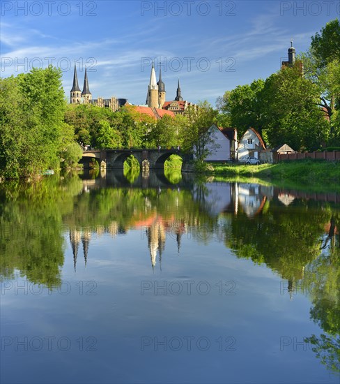 Merseburg Cathedral and Merseburg Castle are reflected in the River Saale
