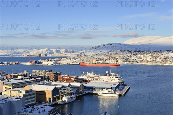 Wide bay with city and Hurtigruten dock