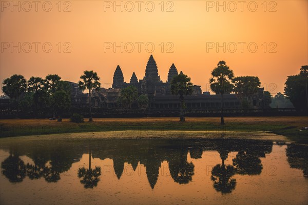 Temple complex of Angkor Wat reflected in the water basin