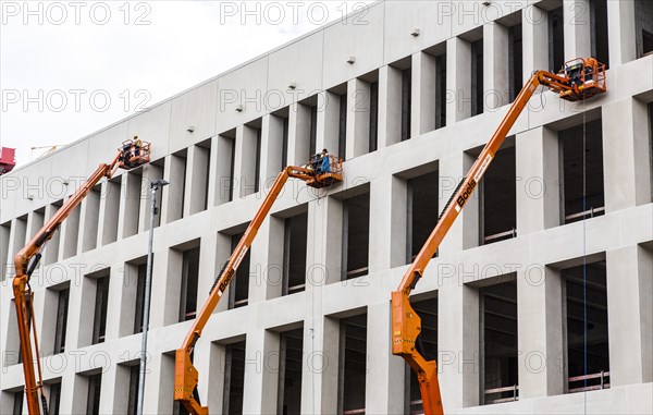 Workers on elevating platforms