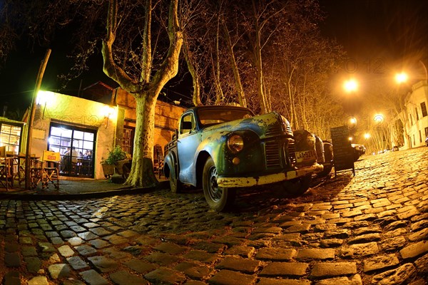 Oldtimer cars on cobblestone street