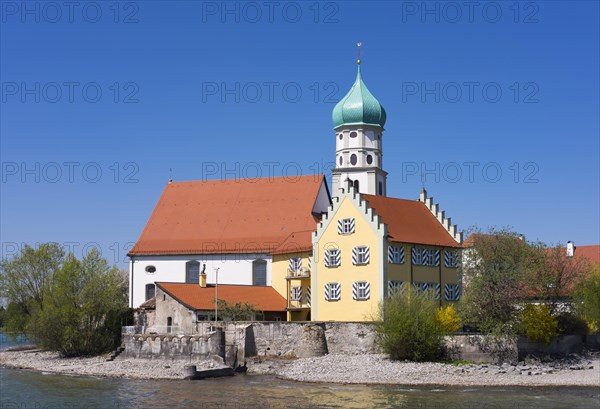Castle and Church of Saint George on the peninsula in Wasserburg at Lake Constance