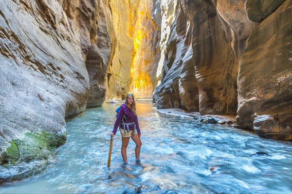 Hiker standing in river