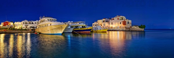 Boat harbour with dive boat at sunset