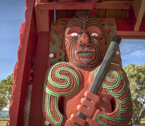 Traditionally carved and painted figure of Maori