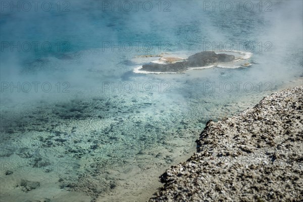 Steaming spring with turquoise water