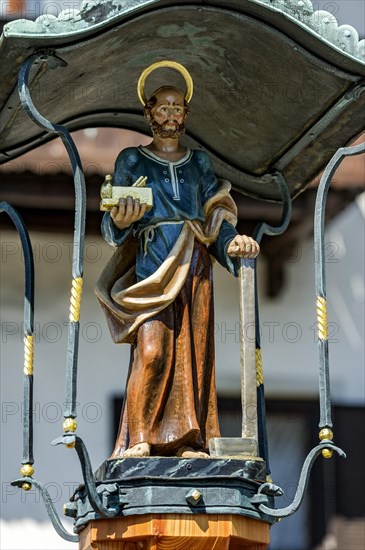 Carved wooden statue of Saint Joseph of Nazareth with plane and machinist square