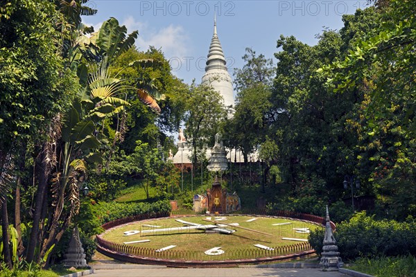 Clock in front of the large stupa in the temple complex Wat Phnom Daun Penh