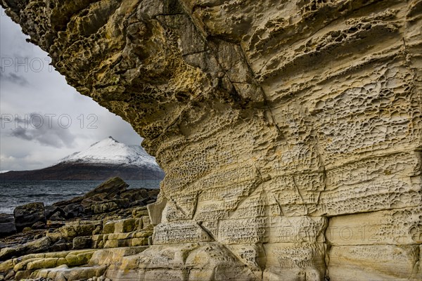 Big rock cliff with North Sea and Cullin Mountains in the background