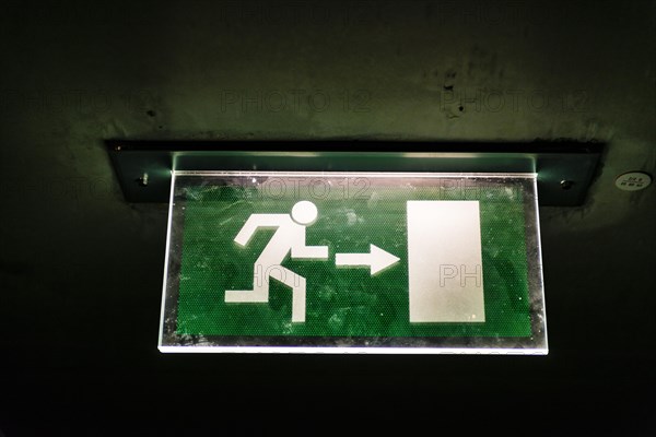 Illuminated emergency exit sign