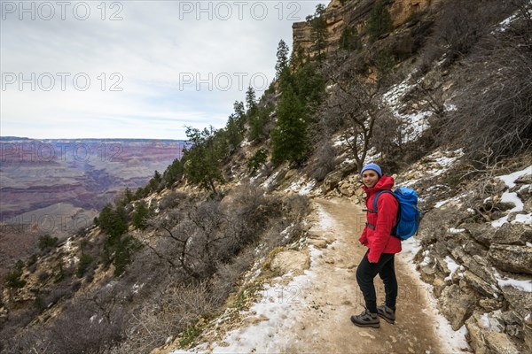Young woman descending into the Grand Canyon