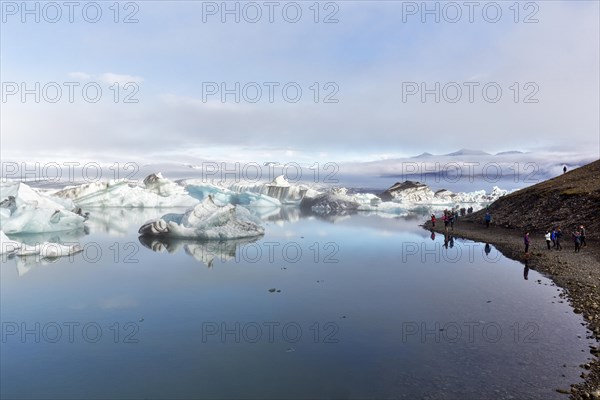 Tourists at the glacier lake