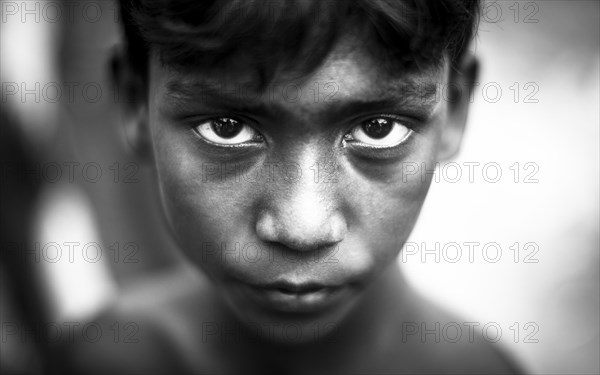 Portrait of a boy in a brickyard