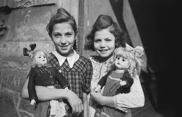 Two girls with dolls