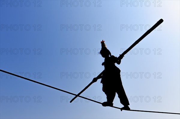 Young girl balancing on rope