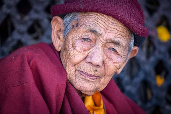 Elderly female Buddhist nun at Boudhanath stupa