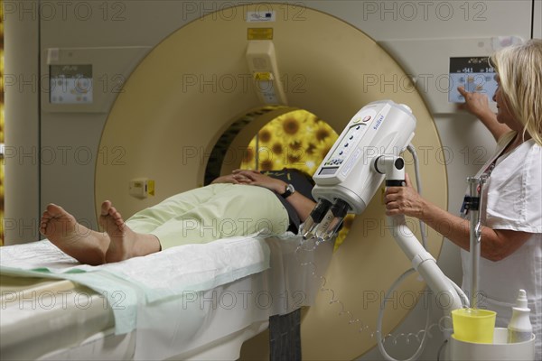 Doctor and patient in the tube during CT