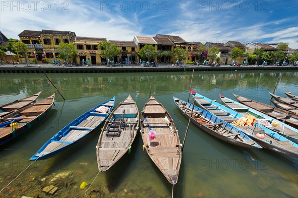 Boats at the river Thu Bon in front of historic old town