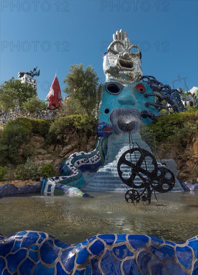 Fountain and colorful sculptures in the Giardino dei Tarocchi or Garden of the Tarot