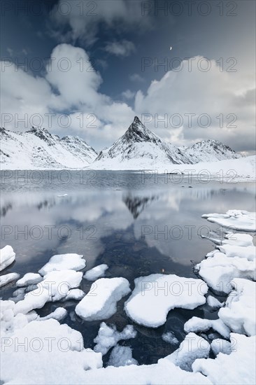 Mount Volandstinden reflected in fjord