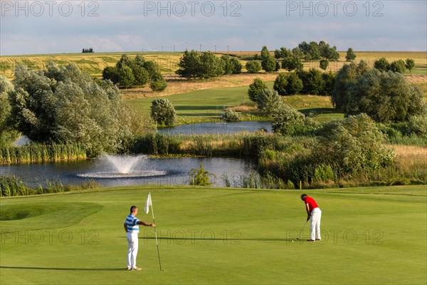 Golf player putting