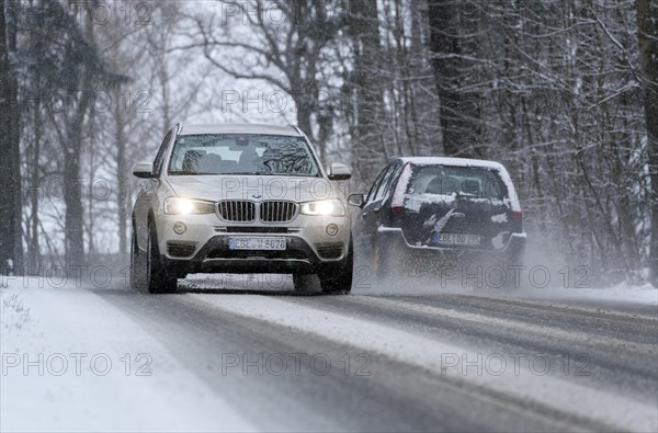 Snowy road with cars