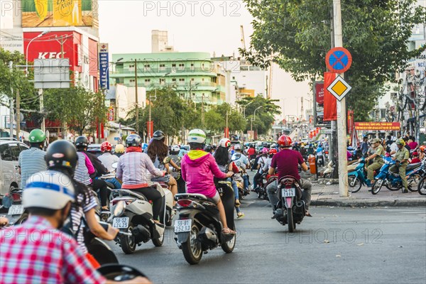 Scooter drivers in heavy traffic