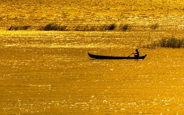 Man paddling boat on River Ayeyarwady or Irrawaddy