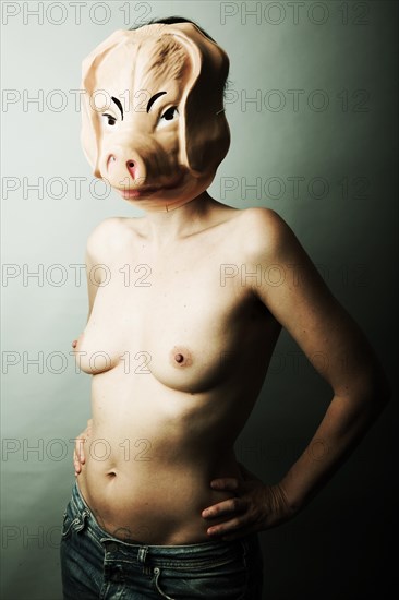 Naked woman with pig mask
