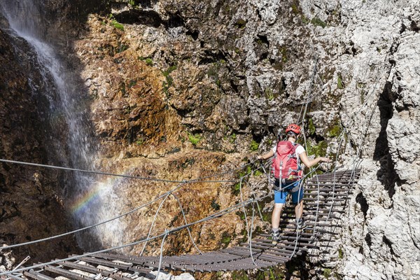 Climbers on suspension bridge