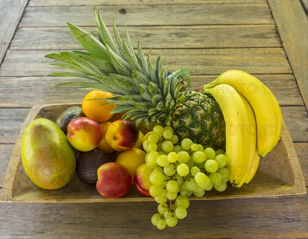 Wooden bowl full of fruit