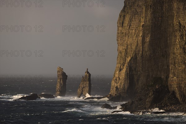 Sea stacks Risin og Kellingin in the evening light