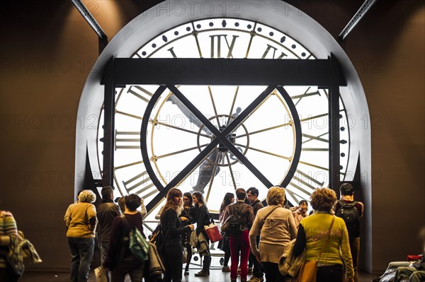 Large clock and people