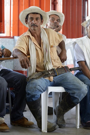 Man with traditional hat and machete