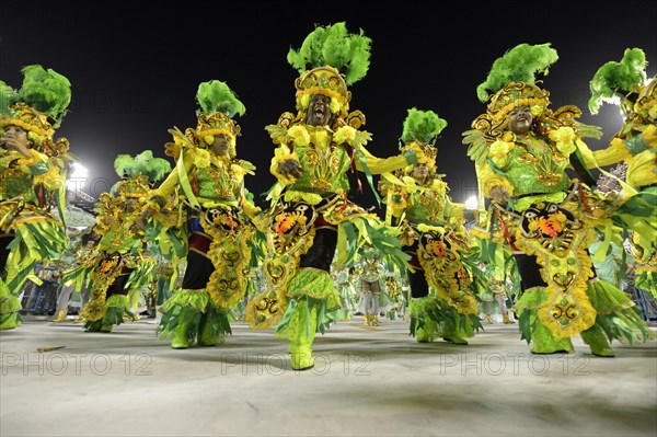 Samba dancers parade of the samba school Beija Flor de Nilopolis