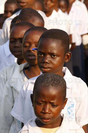 Group of students in schoolyard during morning assembly