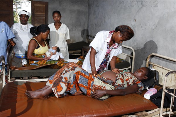 Pregnant woman being examined by a doctor