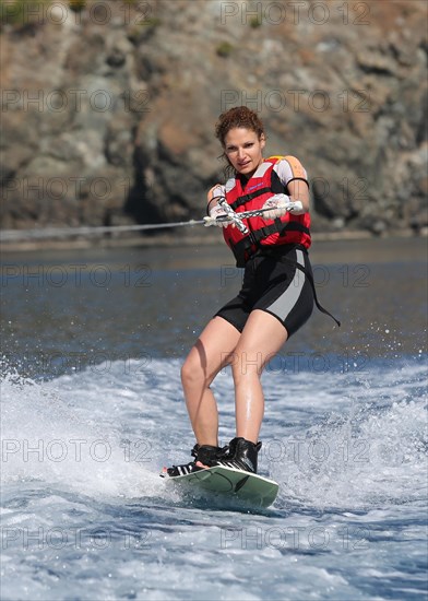 Young woman wakeboarding