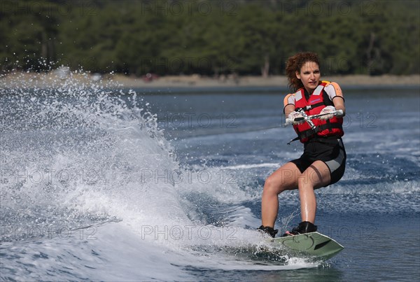 Young woman wakeboarding