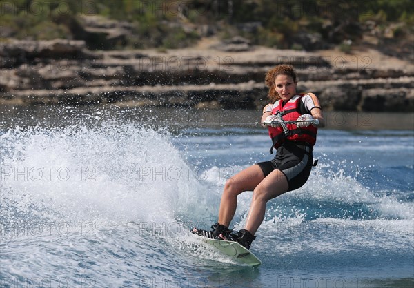 Young woman wakeboarding