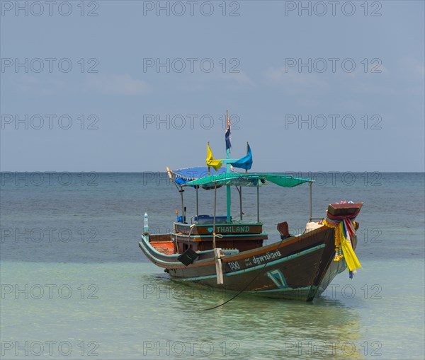 Longtail boat in the turquoise sea