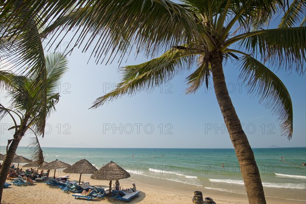 Parasols from palm fronds on Cua Dai Beach in Hoi An