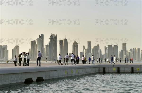 Passers-by and skyscraper skyline