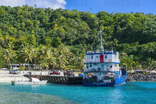 Cargo boat in the harbour of Tau Island