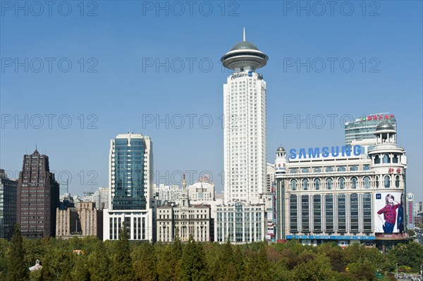 Skyscrapers at the park with Radisson Blu Hotel Shanghai New World