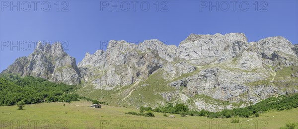 Limestone wall Picos de Europa and Pena Remona mountain peak